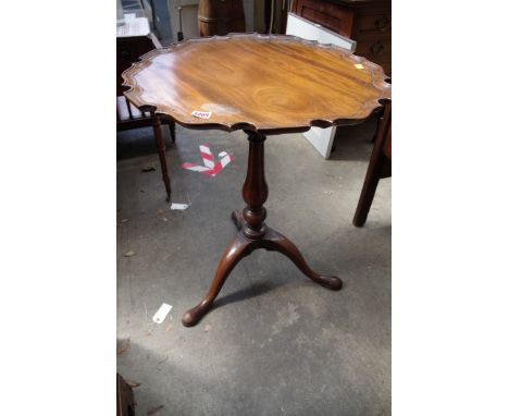 A George III mahogany piecrust tilt top tripod table,&nbsp;57cm wide. 