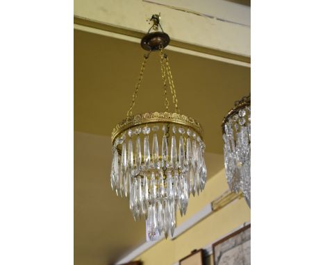 A vintage brass three tier ceiling light, having glass drops, height excluding fitting 24cm. 