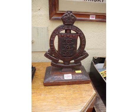 A carved mahogany crest 'Royal Corps Army Ordnance',&nbsp;28cm high. 