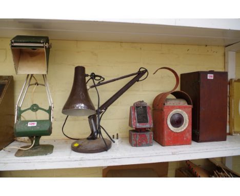 A vintage adjustable desk lamp; another later example; and two vintage paraffin road work lamps.&nbsp;&nbsp; 