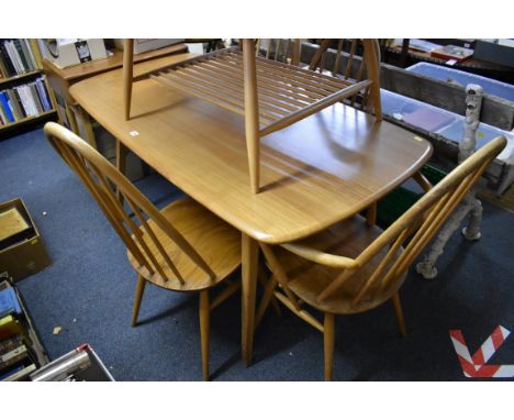A vintage Ercol 'Blonde' dining table,&nbsp;152cm, together with five Ercol dining chairs. 