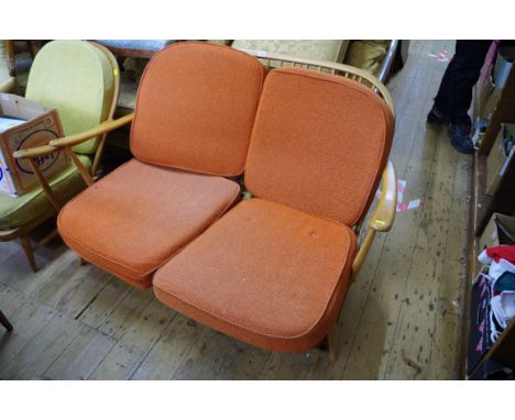 A vintage Ercol 'blonde' two seat Windsor sofa, upholstered, 123cm arm to arm. 