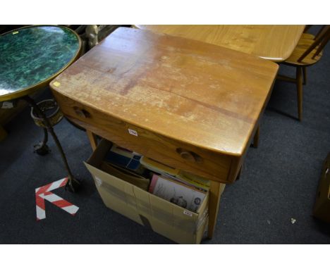 A vintage Ercol elm single drawer desk, 68cm wide.&nbsp; 