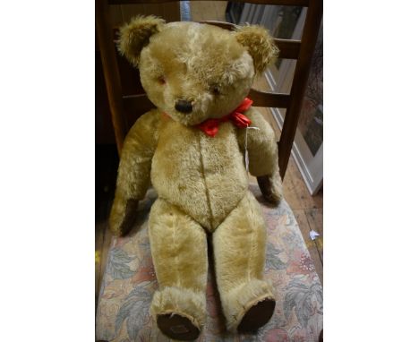 A large vintage Chad Valley golden mohair teddy bear,&nbsp;with&nbsp;straw filled head and leather pads, approx 73cm long. 