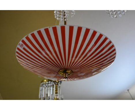 A 1950s red and white striped glass ceiling light, having brass fittings, 48cm diameter, (s.d.). 