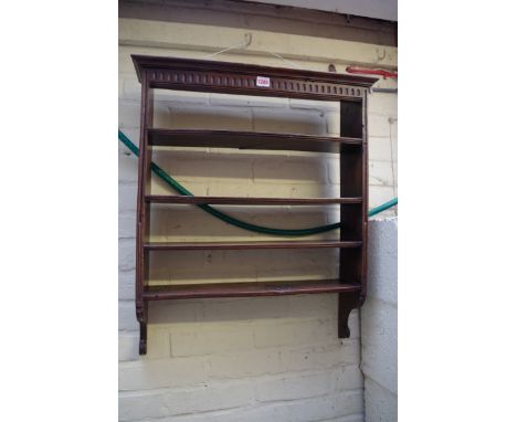 An antique French fruitwood hanging shelf,&nbsp;61cm wide. 