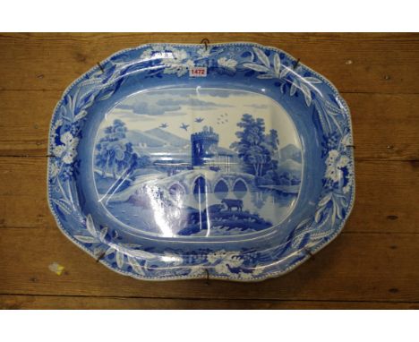 A 19th century Spode 'Bridge of Lucano' pattern blue and white meat plate,&nbsp;of tree and well design, 52.5cm wide. 