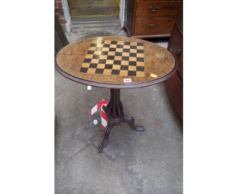 A Victorian walnut and chequerboard inlaid oval tripod table,&nbsp;60cm wide. 