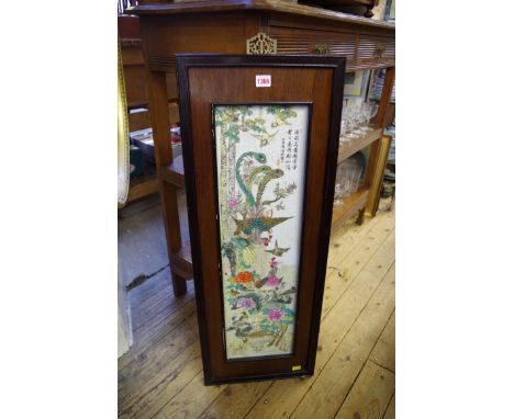 A Chinese ceramic panel, decorated with exotic birds and flowers, 72 x 20cm.