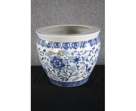 A blue and white ceramic planter. H.35cm. 