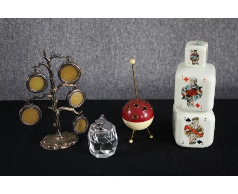An Art Deco sputnik Bakelite cigarette holder, Italian milk glass playing card design decanter and a silver plated tree photo