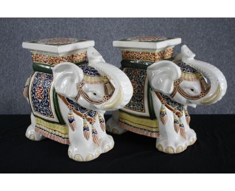 A pair modern oriental style ceramic elephants. Garden stools. Hand painted and well detailed. H.41cm. 