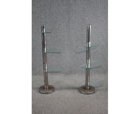 A pair of Art deco display stands with semi circle glass shelves. With six tiers of adjustable positions. Chrome with some li