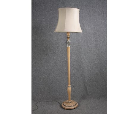 A standard floor lamp with a decorative stem. H.183cm. 