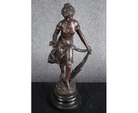 After Henryk Kossowski (Polish). Two patinated brass figures. Titled 'Automne' (autumn). Set on wooden stands. H.52cm. (large