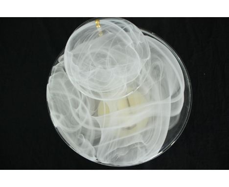 A brass wall mounted light with flat glass shade. Dia.30cm. 