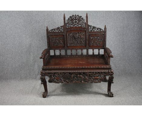 Hall bench, Chinese hardwood with carved and pierced decoration raised on cabriole supports. H.132 W.115 D.64cm. 