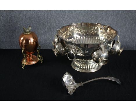 A silver plated repousse punch bowl with five attached cups and a ladle. Also, a copper boiled egg cooker with hen finial. H.
