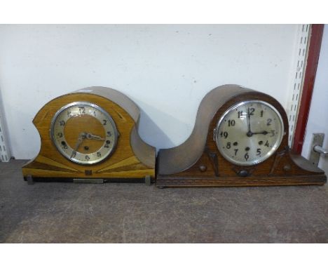 An oak mantel clock and walnut mantel clock