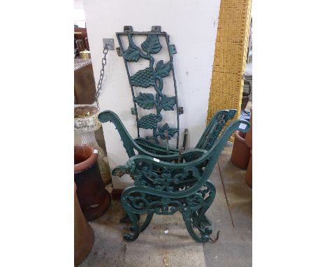 Two pairs of cast metal garden bench ends and a back support