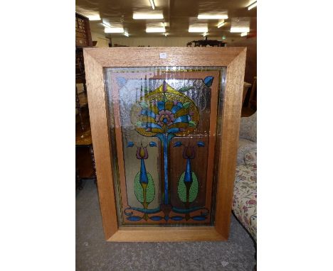 An Art Nouveau style painted glass window