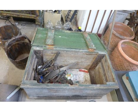 A pine tool chest with tools