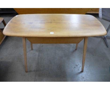 An Ercol Golden Dawn single drawer desk