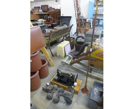 A Singer sewing machine, hunting horn, cobblers last and dumbbells
