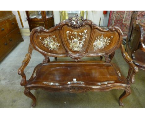 An Art Nouveau style hardwood settee inlaid with mother of pearl and abalone