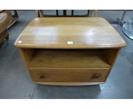 An Ercol Golden Dawn television stand