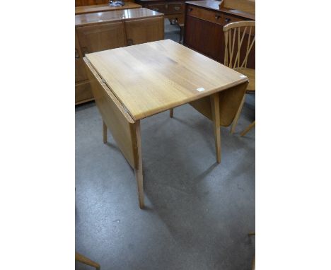 An Ercol Golden Dawn drop-leaf table
