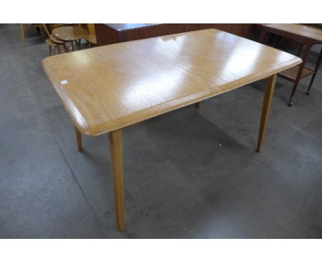 An Ercol style extending dining table
