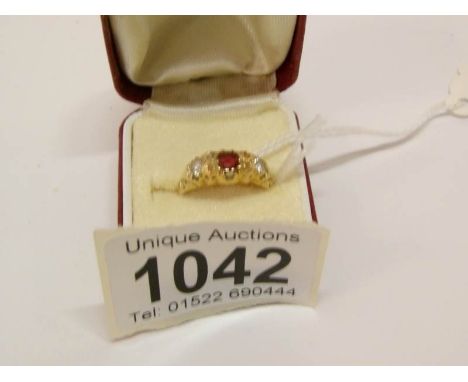 An 18ct gold ring set ruby and diamonds, size M