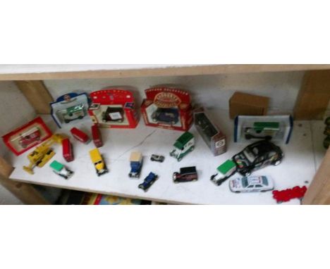 A mixed lot of die cast vehicles, some boxed, 1 shelf