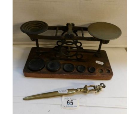 A set of old postal scales and a life boat man paperknife