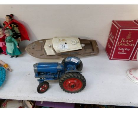 A Chad Valley Fordson tractor and a 'Derwent' battery operated boat a/f