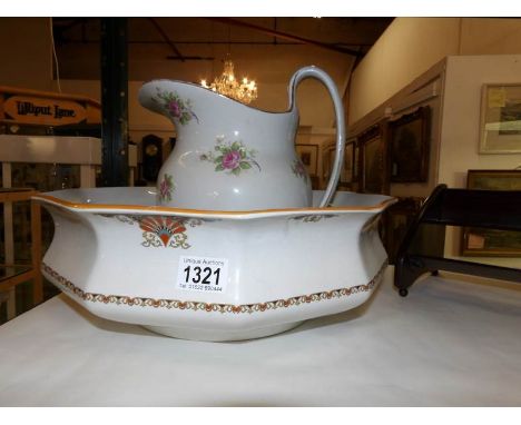 A large wash basin and a jug