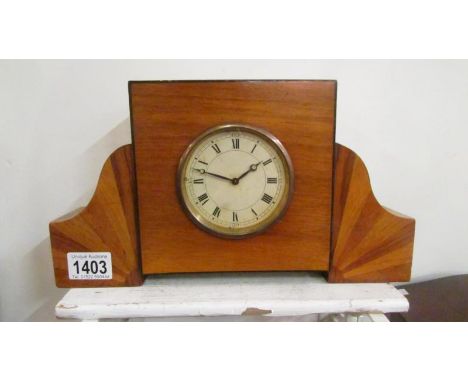 An art deco veneered mantel clock