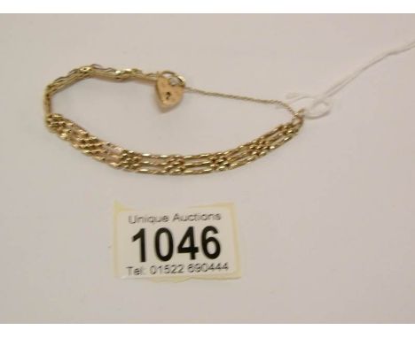 A 9ct gold 3 bar gate bracelet, 12 grammes