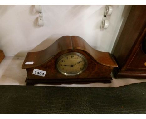 A mahogany mantel clock with walnut veneered front by E T Biggs & Sons, Maidenhead