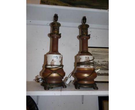 A pair of spelter and porcelain Grecian style table lamp bases