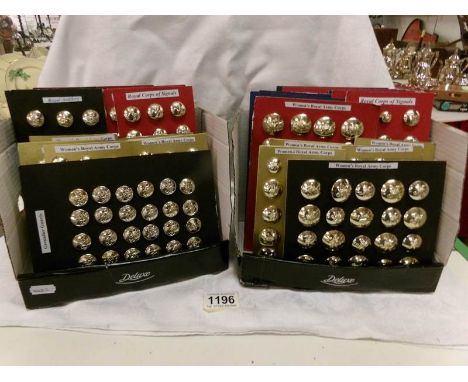 A collection of military buttons including Women's Royal Army Corps