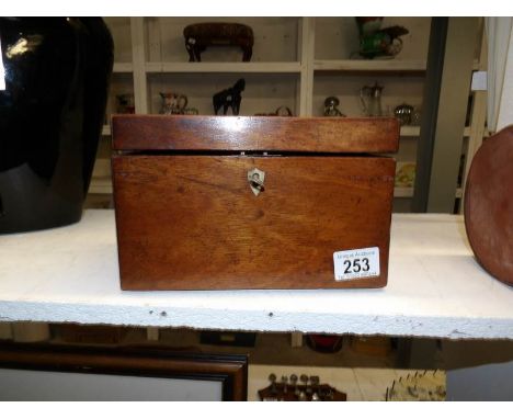 A mahogany tea caddy