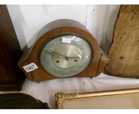 An oak mantel clock