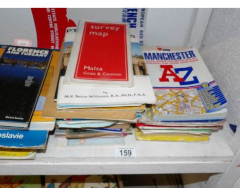 A collection of ordnance survey maps, A-Z's, town guides etc