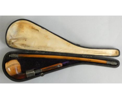 A Victorian meerschaum pipe, the plain bowl with silver mounts and two lengths of pipe, overall length 35 cm, case. 