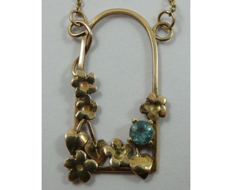 A 9ct gold and blue zircon pendant, in a floral mount, a similar bangle and pair of ear rings, gross weight 9.5 gms. 