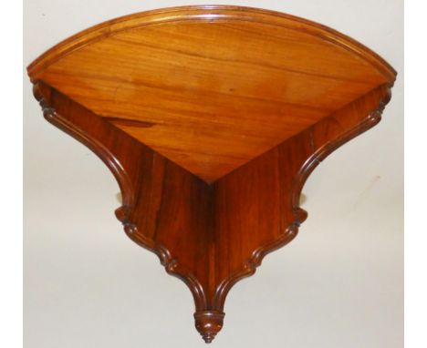 Marsh, Jones &amp; Cribb, late Kendell &amp; Co., a Victorian rosewood corner shelf, the shaped panels with thumbnail border,