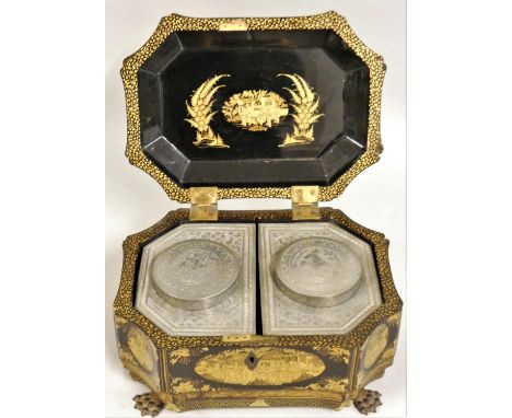 A George III Chinoiserie papier maché tea caddy, of sarcophagus form with canted corners over ogee trunk, raised on dragon ma