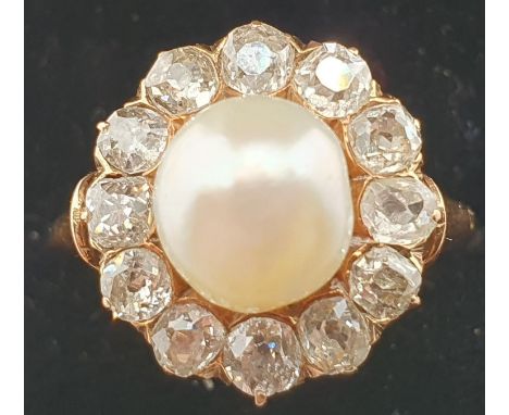A Victorian natural pearl and diamond cluster ring, the peg set natural saltwater bead, measuring 7.8 - 8.1mm, weighing 3.10 